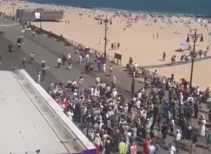 Overhead view of the Stop Mamdani rally crowd on the Brighton Beach Boardwalk in Brooklyn, New York, May 17, 2026