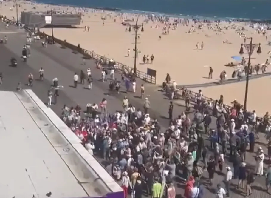 Overhead view of the Stop Mamdani rally crowd on the Brighton Beach Boardwalk in Brooklyn, New York, May 17, 2026